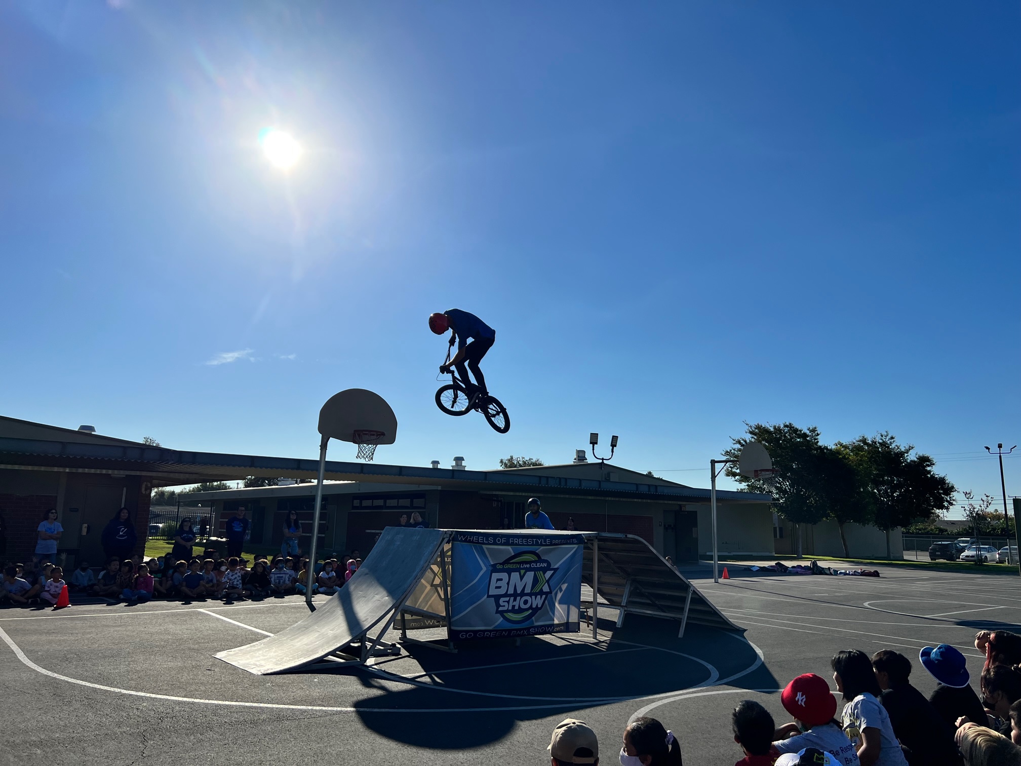 Students enjoy the show as Pro BMX riders show their skills