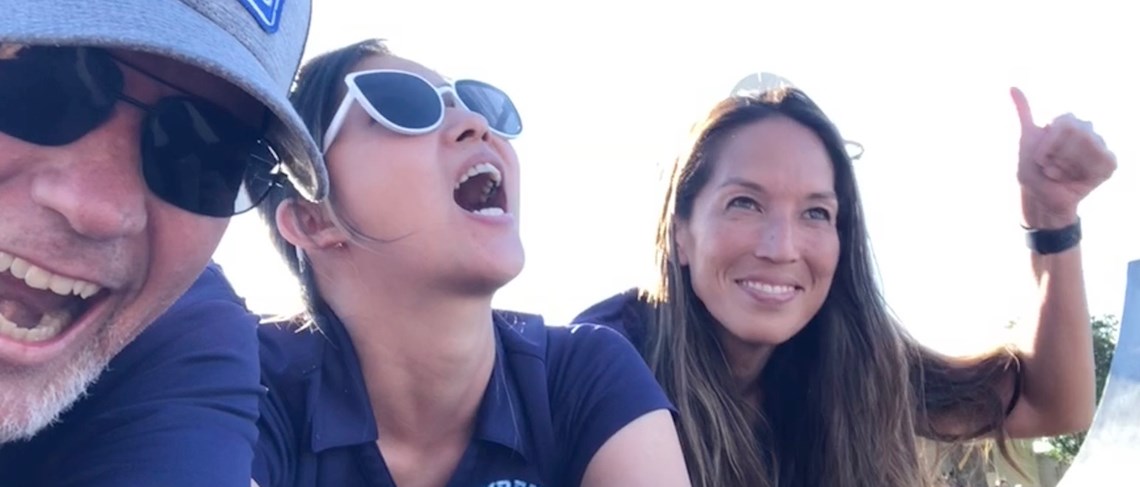 Mr. T, Ms. Pho, and Ms. Kawai prepare for BMX riders to jump over them